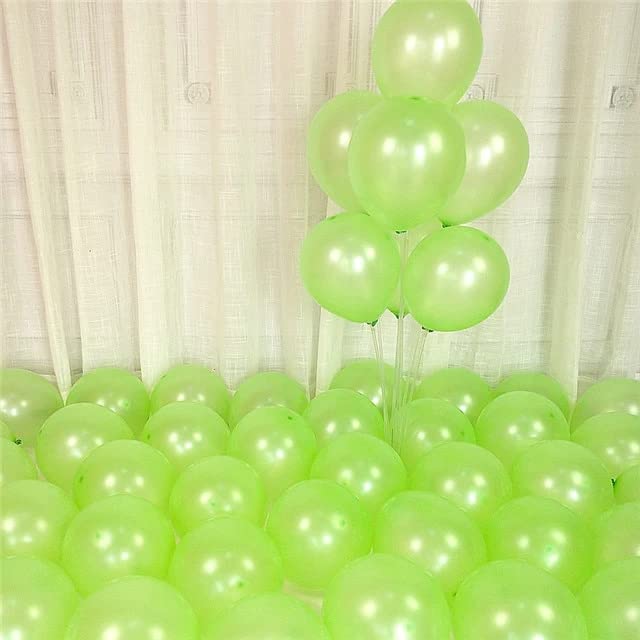 Green balloons scattered on the floor, perfect for party decorations and celebrations.