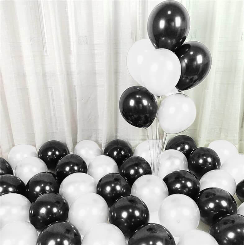 Black and white balloons arranged for decoration, ideal for parties, weddings, and celebrations.