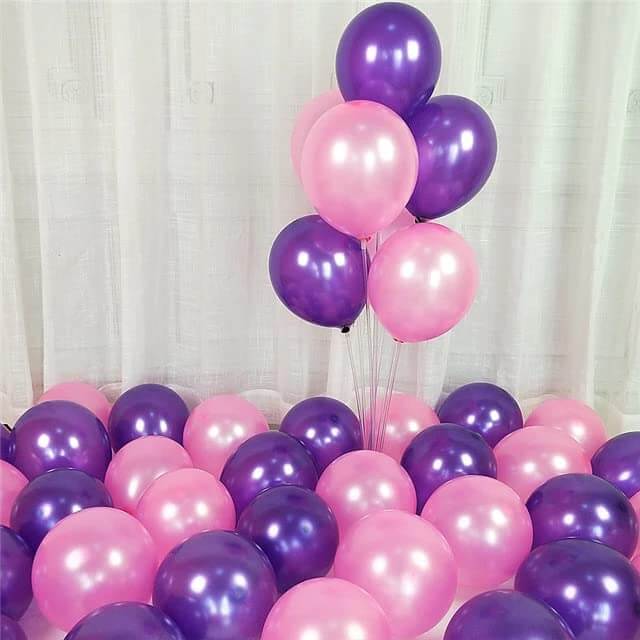 Purple and pink balloons arranged for party decoration, ideal for birthdays, weddings, and celebrations.