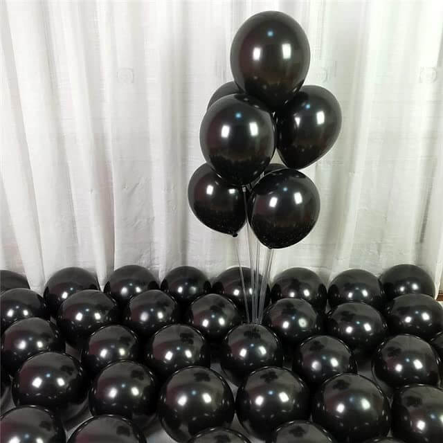 Pack of black balloons arranged for party decoration, perfect for celebrations and events.
