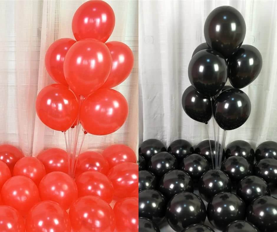 Red and black balloons arranged for decoration, great for parties and celebrations.