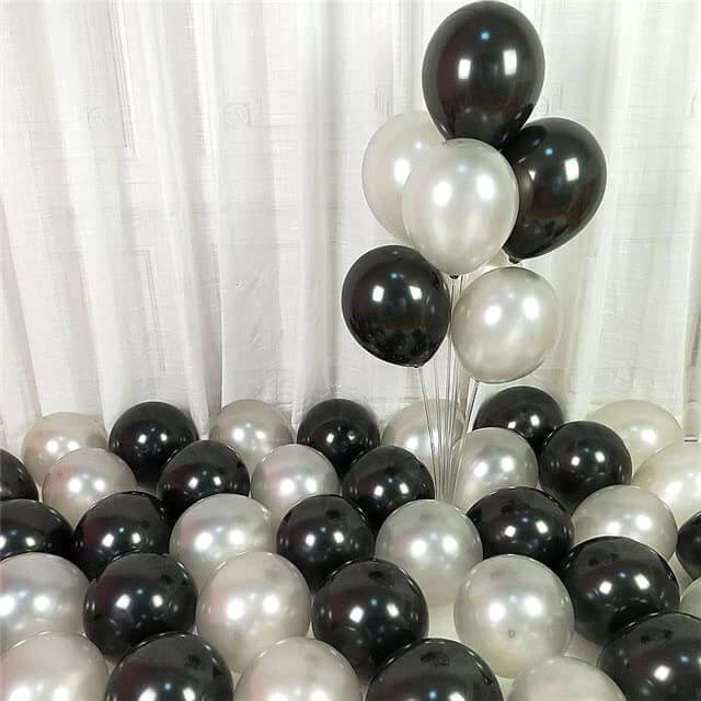 Elegant black and silver balloons arranged for event decoration, ideal for parties, weddings, and celebrations.