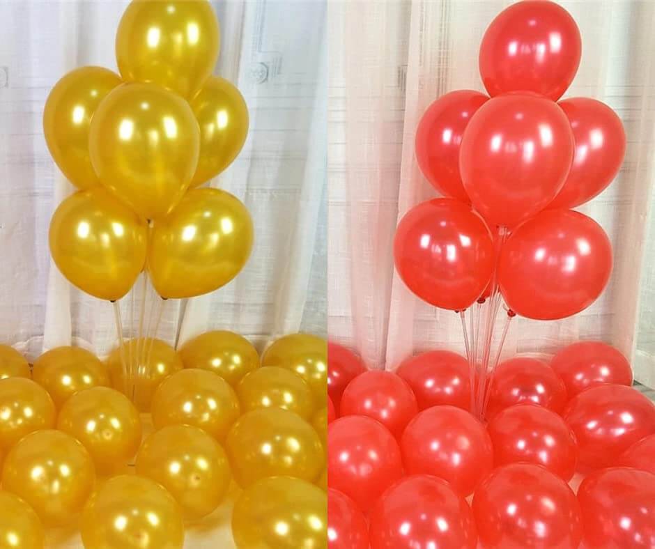 Golden and red balloons arranged decoratively, perfect for party decorations and celebrations.