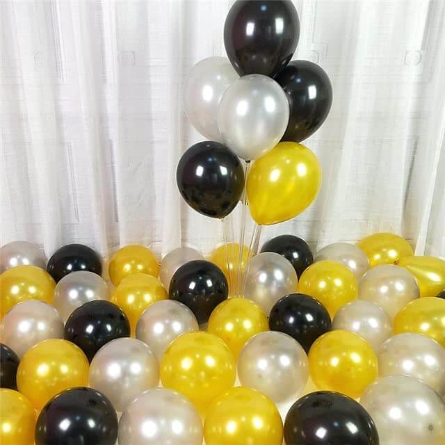 Black, gold, and silver balloons arranged for a festive celebration or party decoration.