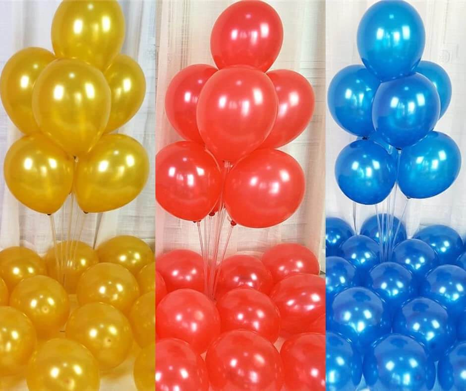 Gold, red, and blue metallic balloons arranged for festive decorations, ideal for parties and celebrations.