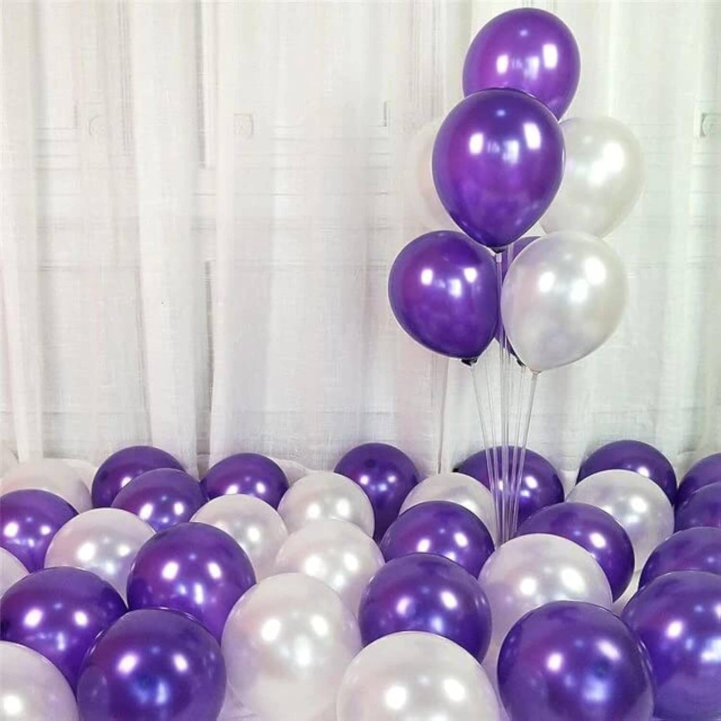 Purple and white balloons for party decoration, perfect for birthdays, weddings, and celebrations.