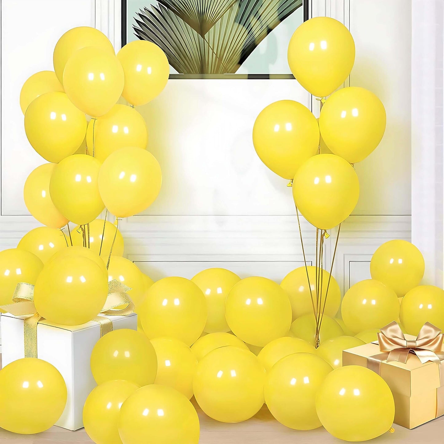 Yellow balloons decor for celebrations, with balloons on the floor and a gift box, perfect for parties and events.
